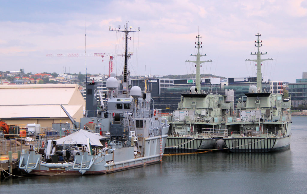 Huon-class minehunters HMAS Norman M84 (Right) with HMAS Hawkesbury M83 (Left) with Ocean Recovery Behind