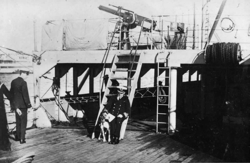 Broome Commander Viscount, on HMS Raglan with the ships dog