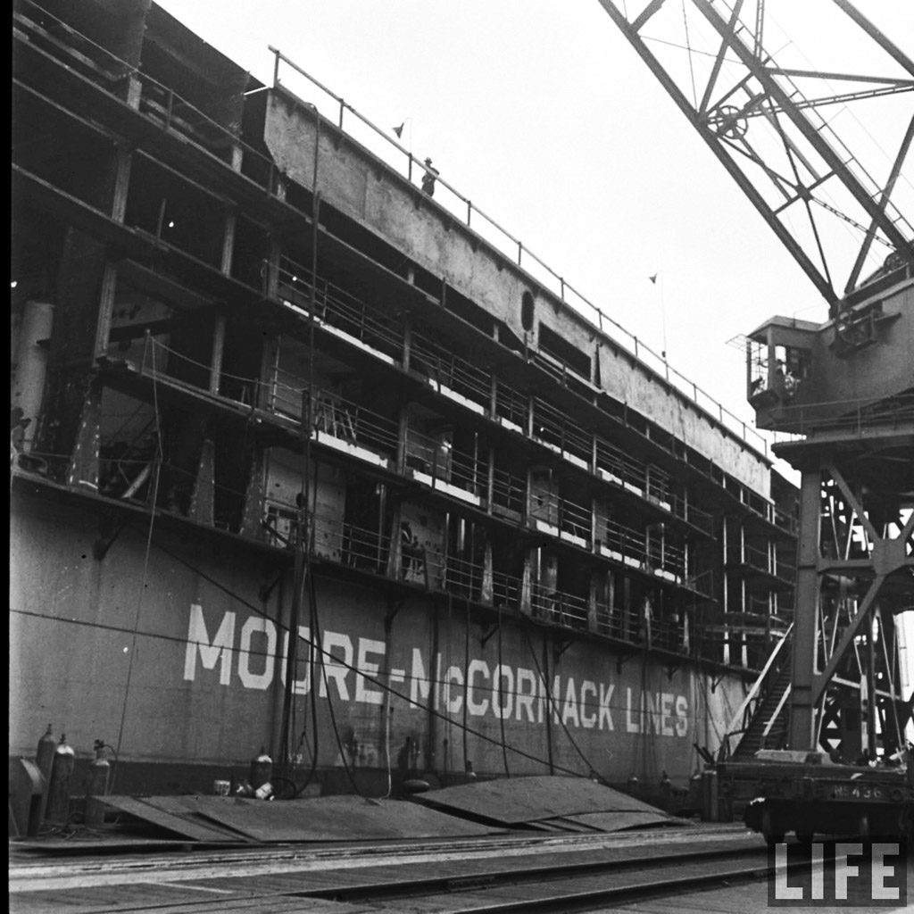 Mormacland, of the Moore-McCormack Lines, being converted into an aircraft carrier, Hampton Roads, VA