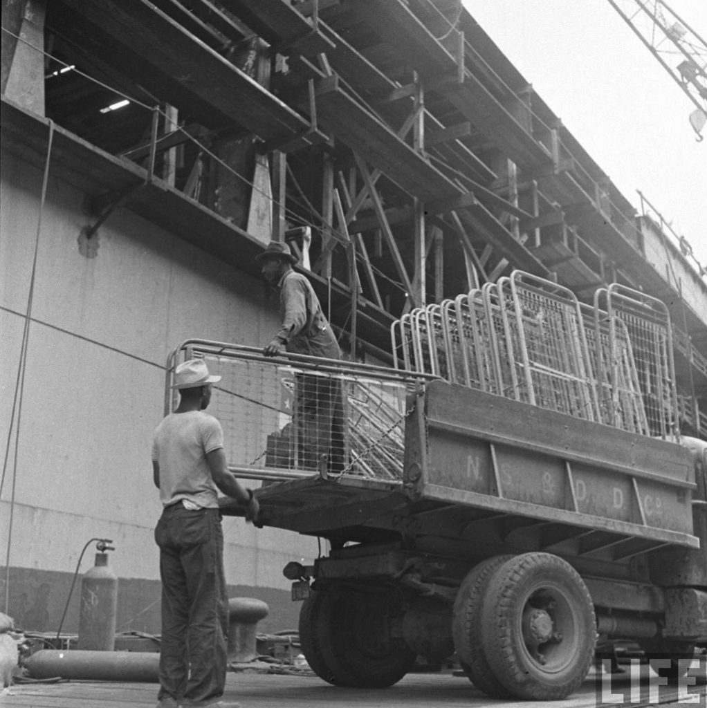 Mormacland, of the Moore-McCormack Lines, being converted into an aircraft carrier, Hampton Roads, VA