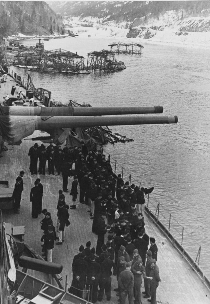 Crewmen on board the battleship, while she was moored in a Norwegian fjord, circa 1942-44.