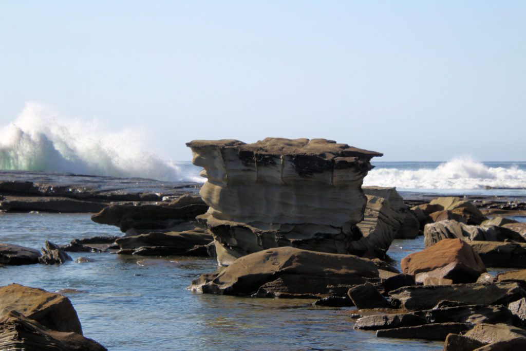 Waves Crashing Over Rocks on the Rock Platform