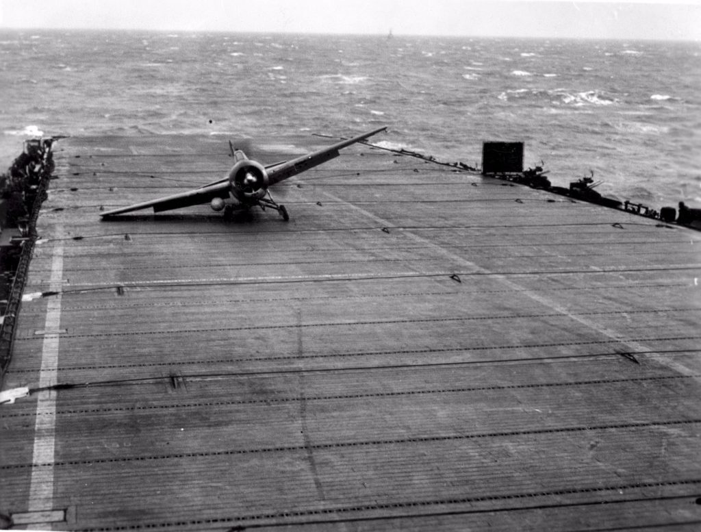 A Wildcat from HMS Puncher damages it's landing gear as it lands on the pitching deck of the carrier in rough weather