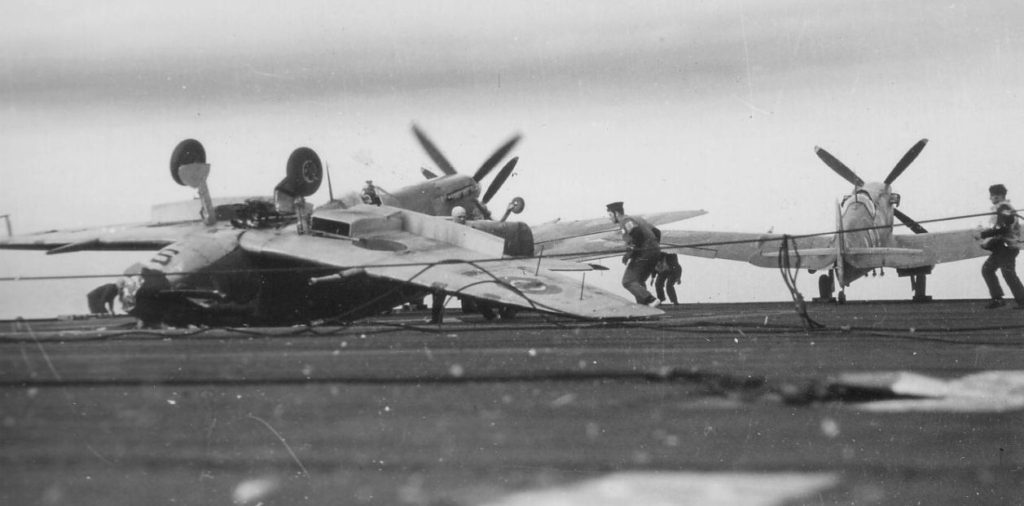 Match 21st 1944; Seafire MB215 floated over all the arrestor the wires, hit the barrier and overturned, the pilot, Sub Lt R.G. Hallas, was unharmed