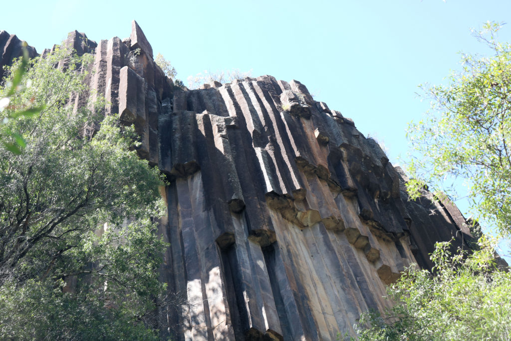 Looking Up From the Creek Bed at the Cliff Face Sawn Rocks