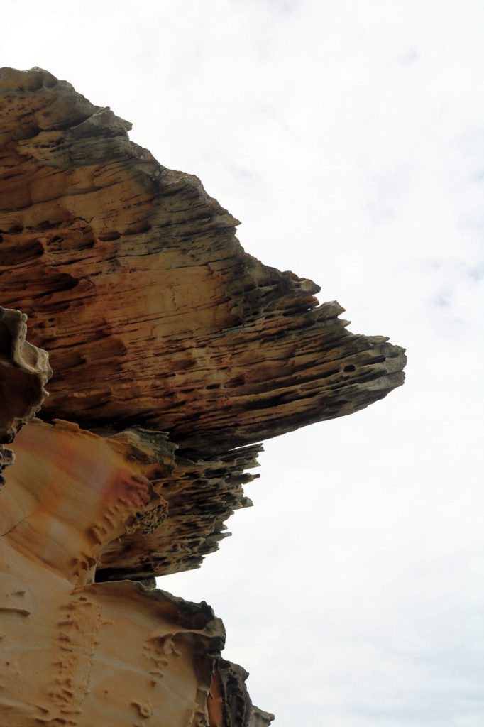 Overhanging Eroded Rock on the Cliff Face