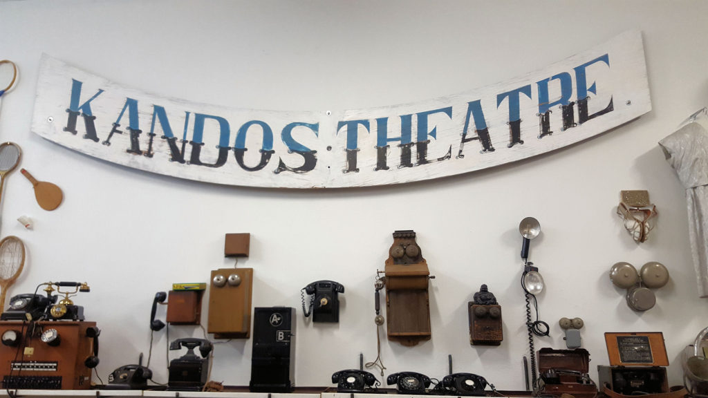 Old Telephones and Cinema Sign