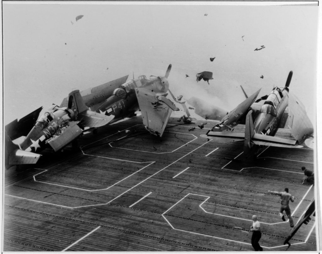 During the crash, the Wildcat is disappearing over the bow