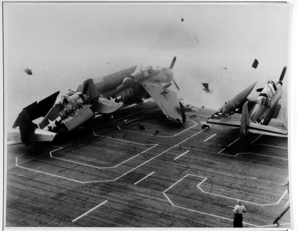 During the crash, the Wildcat is disappearing over the bow