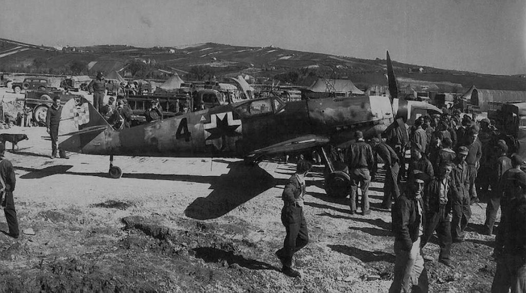 Croatian Messerschmitt Bf 109G-14/AS Black 4 after landing at Falconara airport surrounded by American airmen April 1945