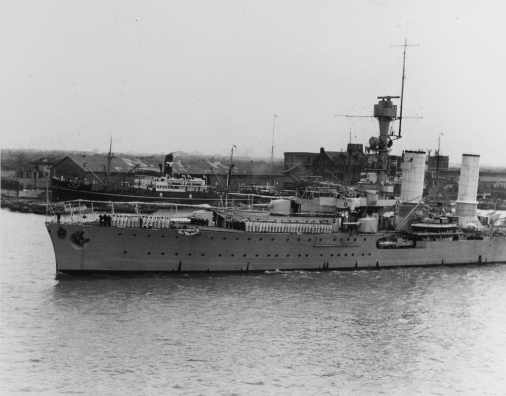 1931, from USS Houston (CA-30), as Emden passes the N.Y.K. shipping line Godowns and docks as she leaves Shanghai, China