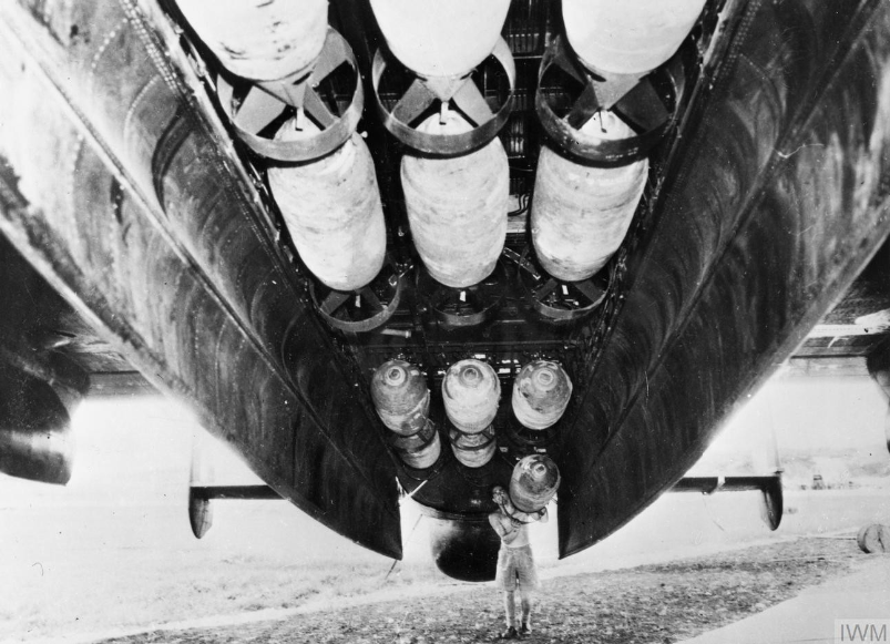 Armorer prepares Avro Lincoln bomber of No 57 Squadron, RAF Tengah, Singapore 1 May 1950