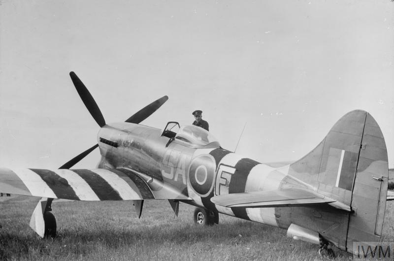 486 Squadron RNZAF, Squadron Leader J H Iremonger, standing by the cockpit of Hawker Tempest Mark V, SA-F