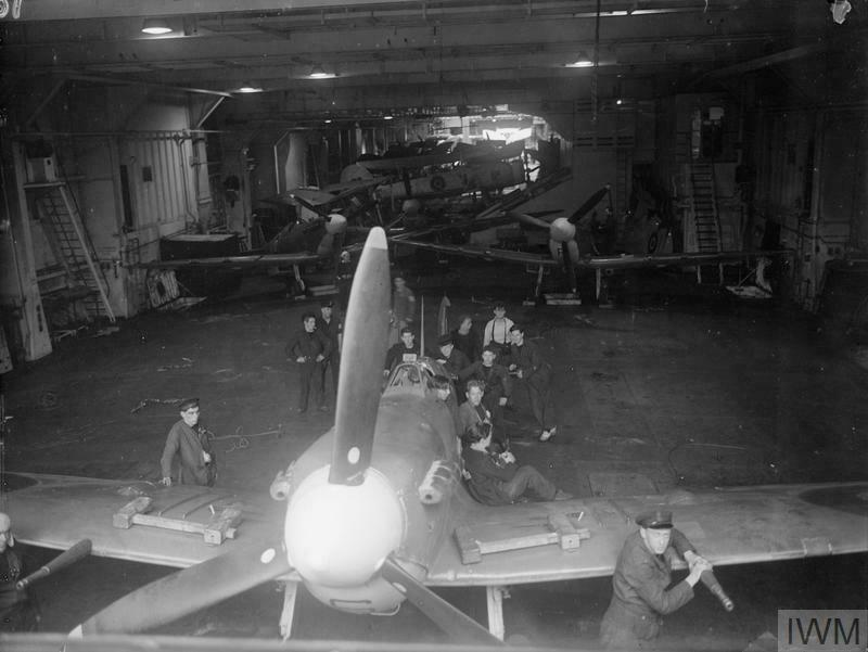 A Supermarine Seafire undergoing maintenance on HMS Tracker Oct 1943