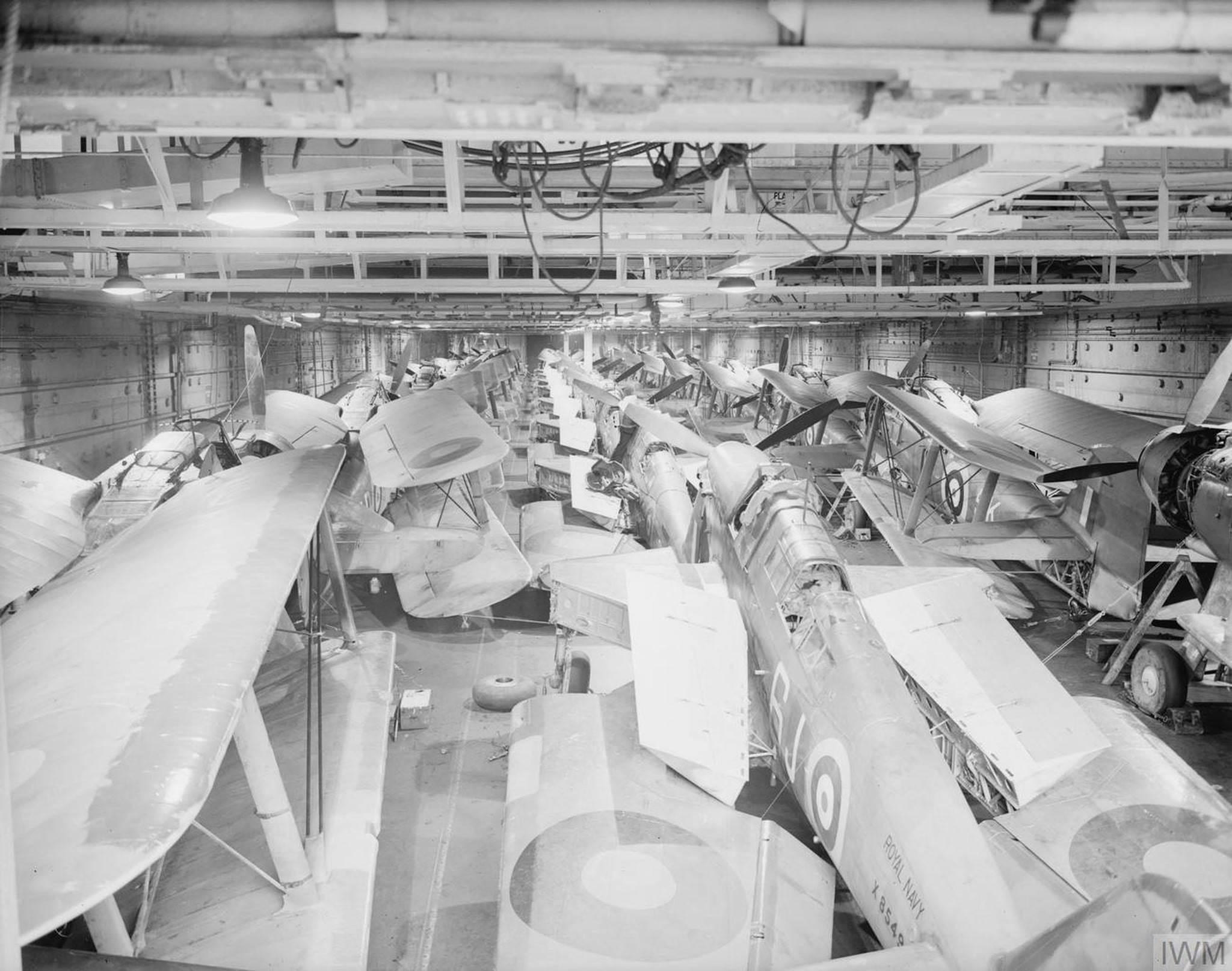 Fairey Fulmars and Albacores fill the hangar of HMS Victorious, January 1942