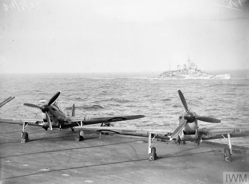 Fulmars on HMS Victorious March 1942 during an Arctic Convoy escort. HMS Renown in the background