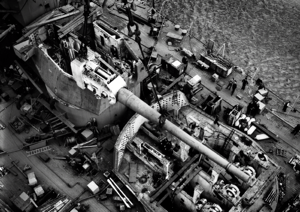 A 14" gun is lowered into B turret on HMS Duke of York, July 1941