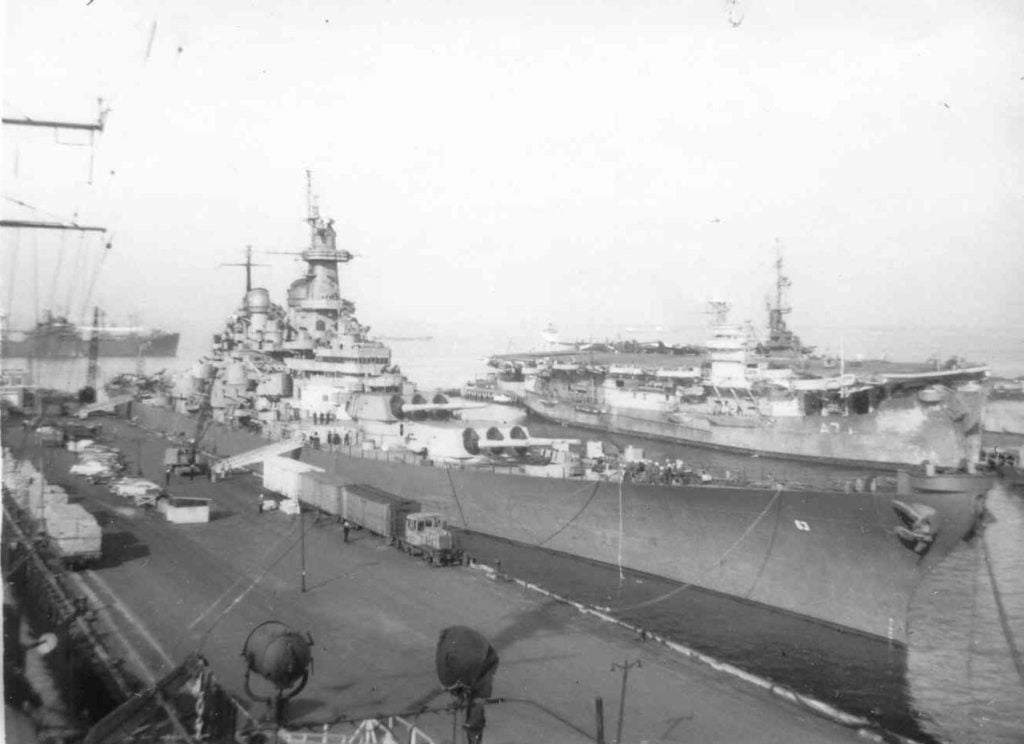 USS Missouri (BB-63) tied up to the pier, 9–12 May 1946 at Norfolk Naval Base, Virginia next to Ruler