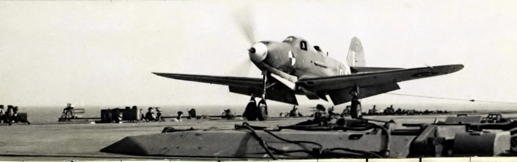 Bell Airacobra AH574 landing on HMS Pretoria Castle 4 April 1945 with Eric Brown at the controls