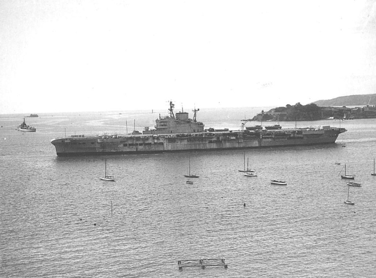 HMS Indomitable seen in 1952 departing Plymouth