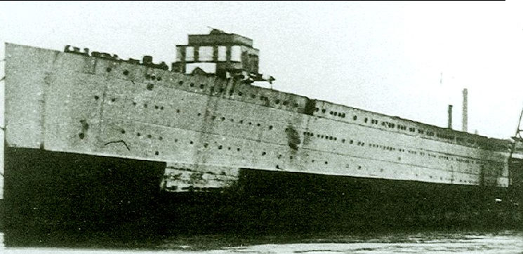 Augustus in 1942, after being requisitioned by the Regia Marina, and being converted into an aircraft carrier Sparviero