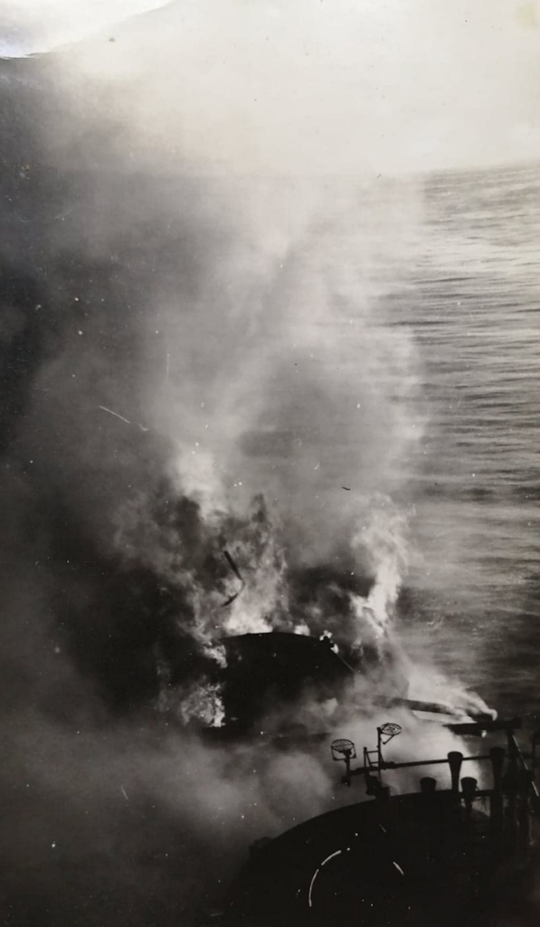 HMS Indomitable on fire after being attacked