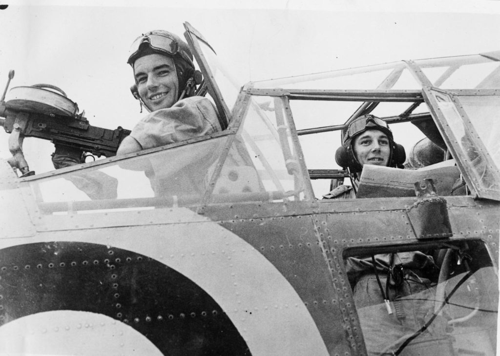 A smile from rear gunner on Fairey Albacore of 826 Naval Air Squadron while the observer checks his charts