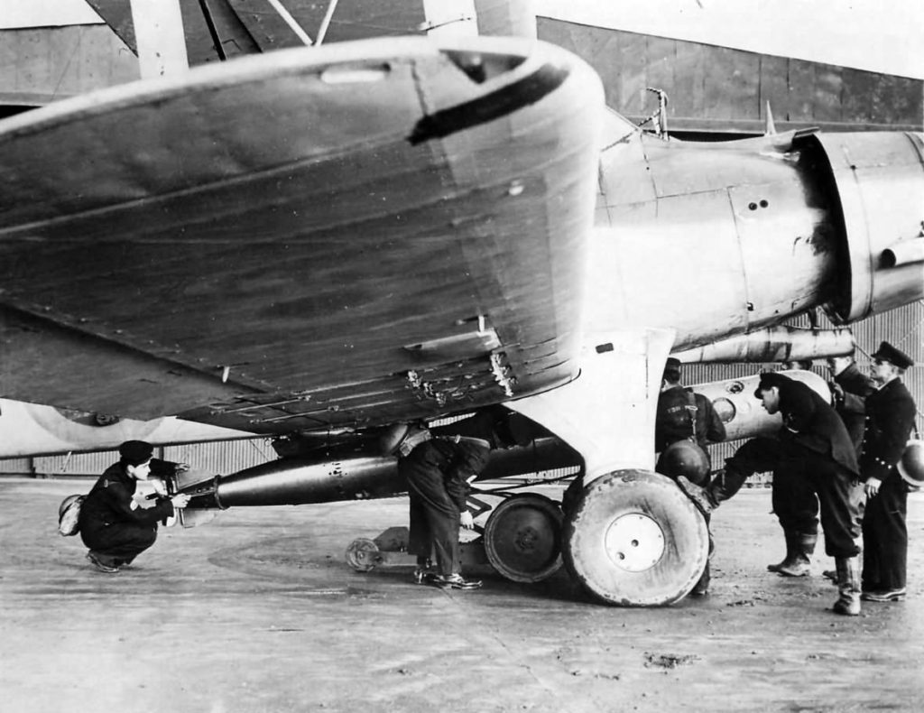 FAA pilot supervises loading of torpedo on his Fairey Albacore