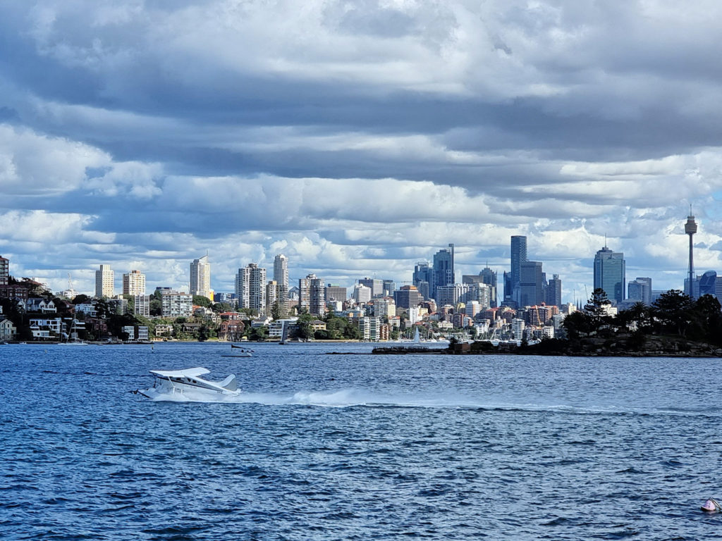 View across the Harbour to the city with a seaplane taking off