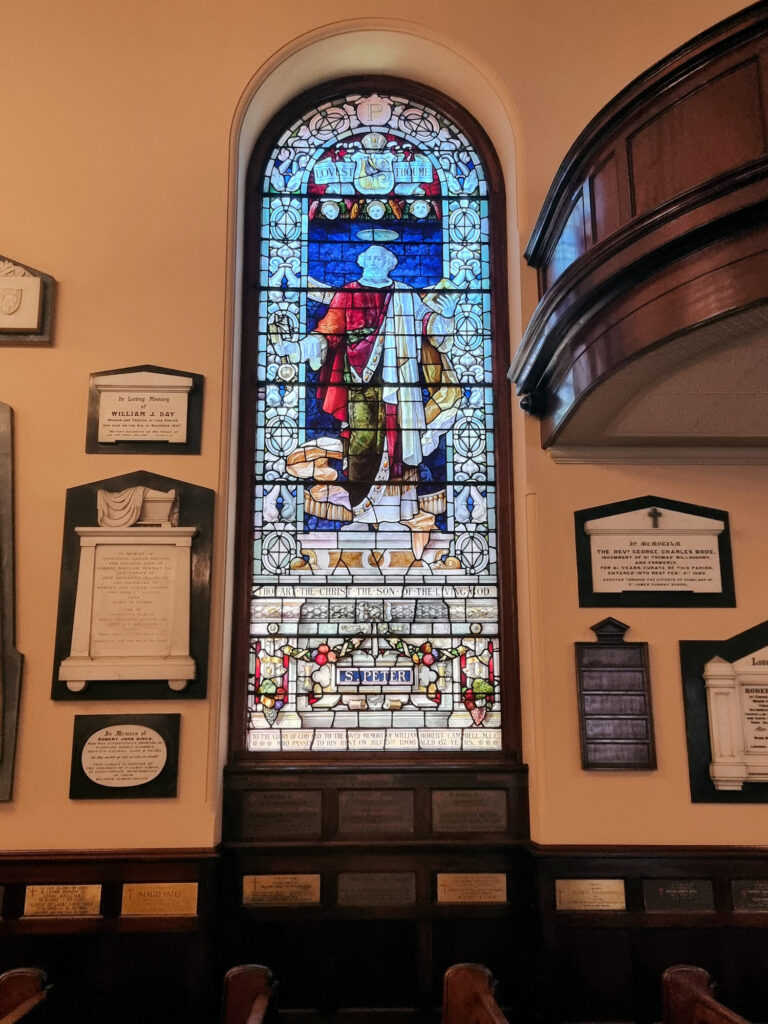 Stained glass window and memorials St James Church