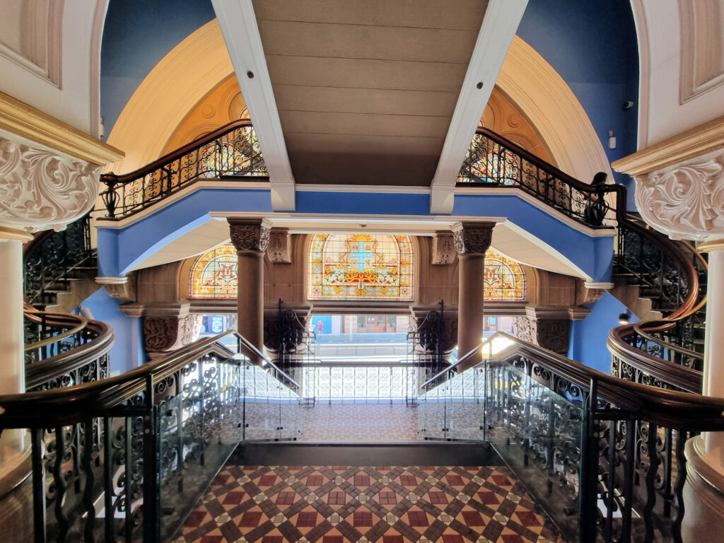 Entrance staircase and stained glass window