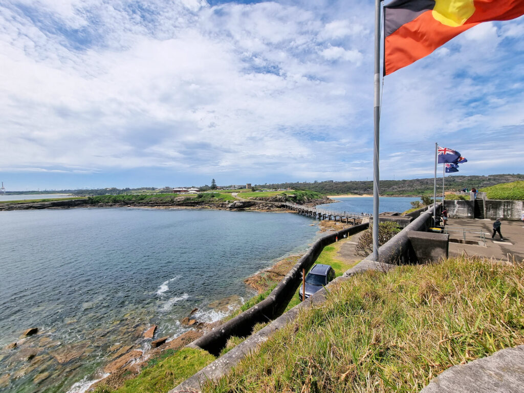 View from Bare Island to the mainland. Aboriginal, Australian and NSW flags.