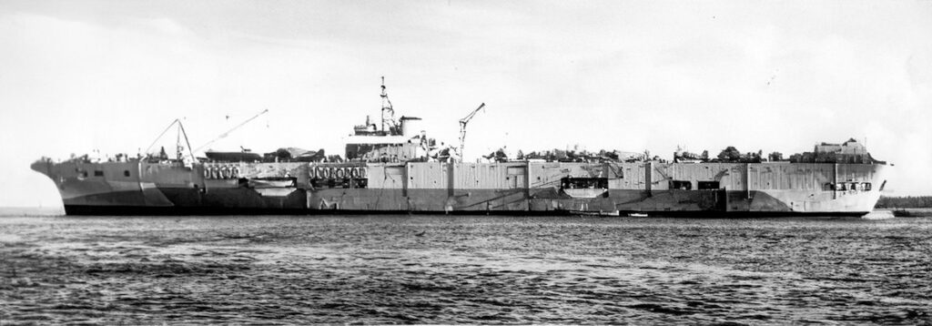 HMS Pioneer at anchor off Pityilu Island, the Admiralty Islands. July 1945