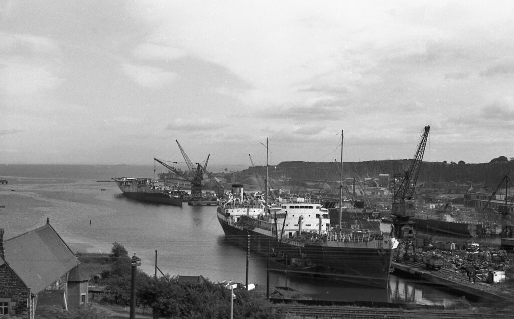 HMS Glory being scrapped in the background. The tanker in foreground is the Latia