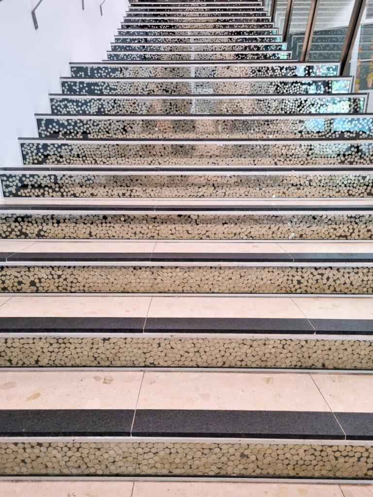 Stairs with coins in the face