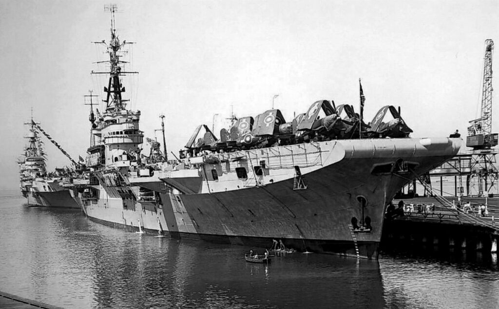 HMS Glory in Melbourne, Australia, January 1946. HMS Implacable is moored astern of her