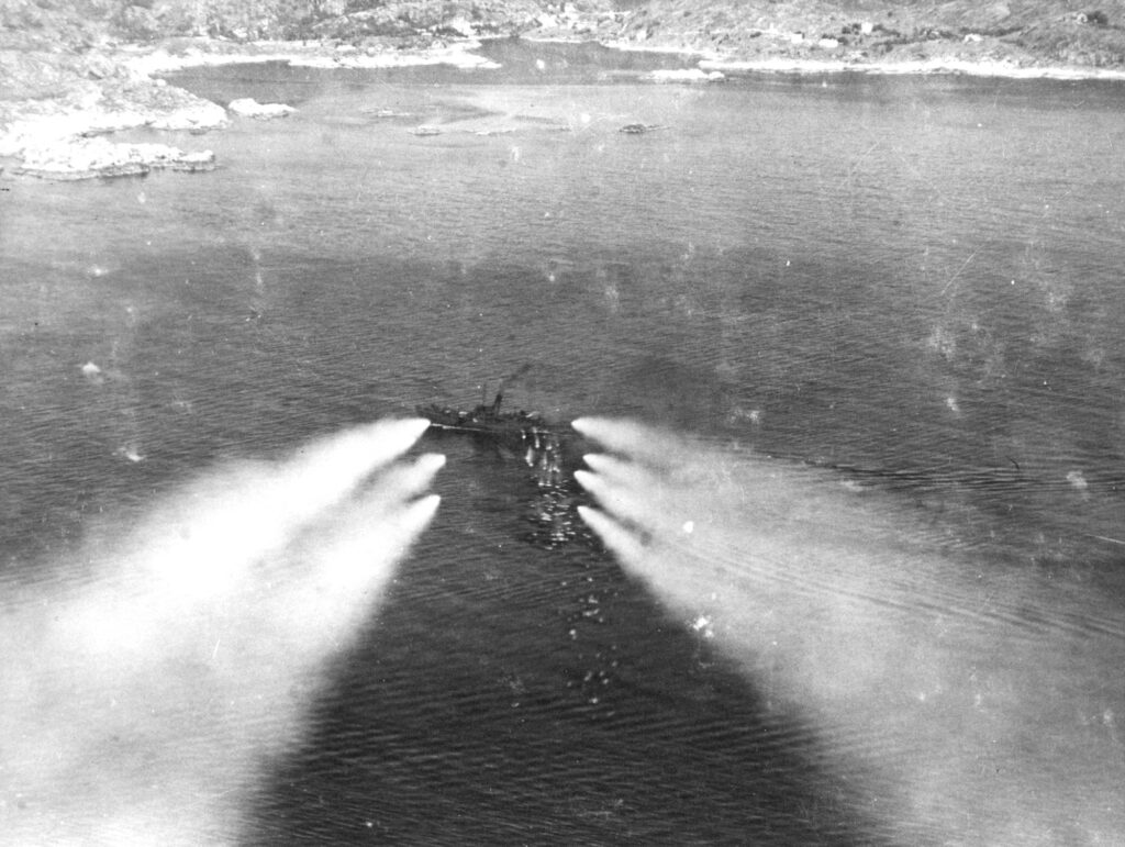 A No. 489 Squadron Beaufighter fires a salvo of rockets at an enemy ship