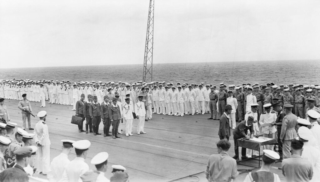 Surrender of Japanese forces in Bismarck Archipelago and New Guinea being formally accepted on board HMS Glory by the Australian General Sturdee at Rabaul.