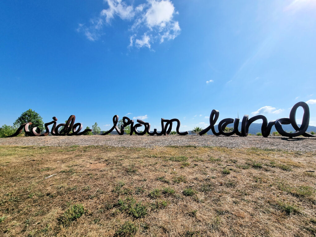 "Wide Brown Land" sign