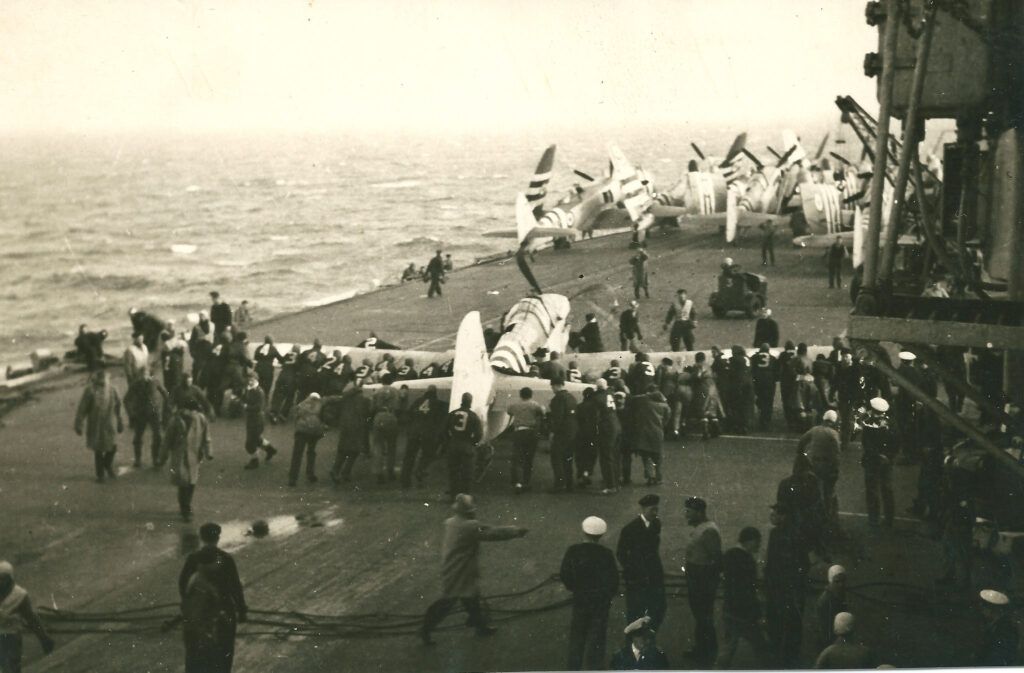 Fairey Firefly being maneuvered on HMS Theseus