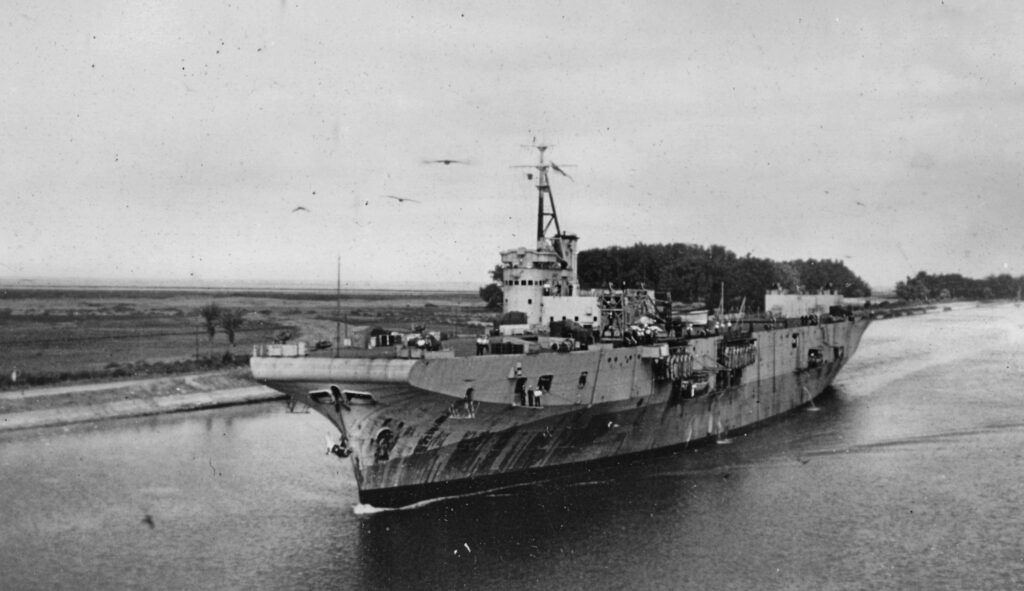 HMS Perseus in the Suez Canal on her way out to Join the BPF. November 1945