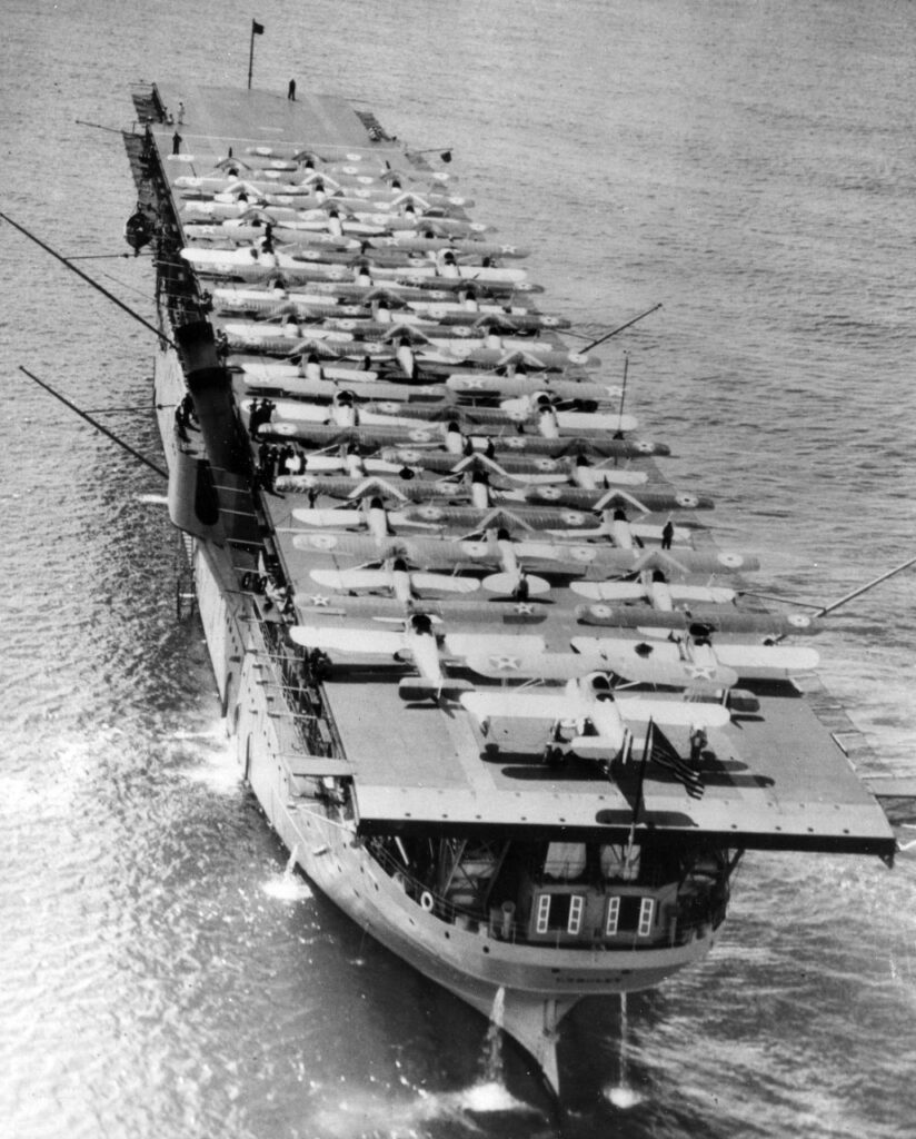 USS Langlley CV-1 off Oahu, Hawaiian Islands, with 34 planes on her flight deck, May 1928