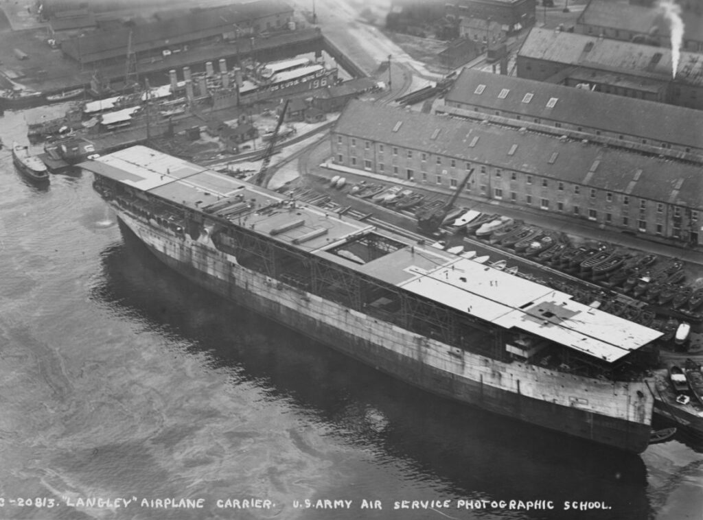 USS Langley CV-1 under reconstruction from the collier Jupiter at Norfolk Navy Yard, Portsmouth, Virginia, circa late 1921