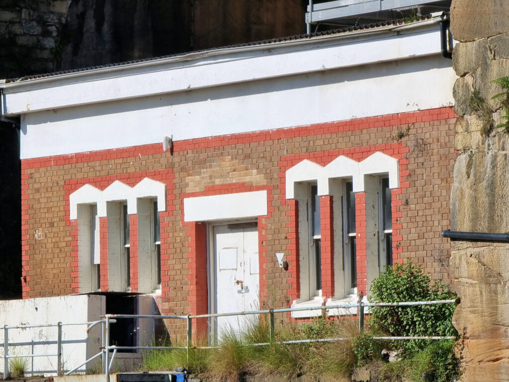 Old administration building built into the cliff wall