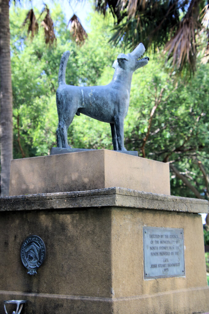 Statue of a fox terrier atop a drinking fountain, with drinking troughs for dogs Bradfield Park