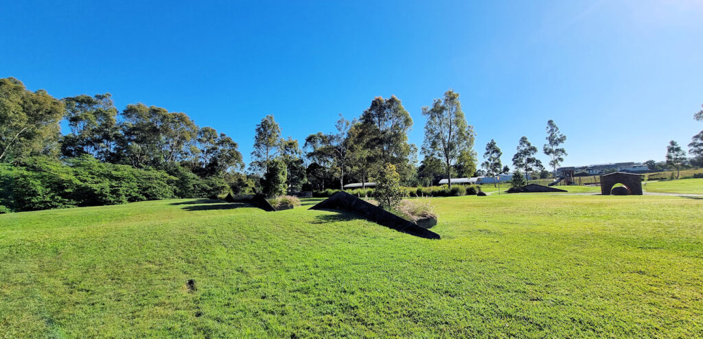 Rehabilitated area with retaining walls made to look like industrial building rooves