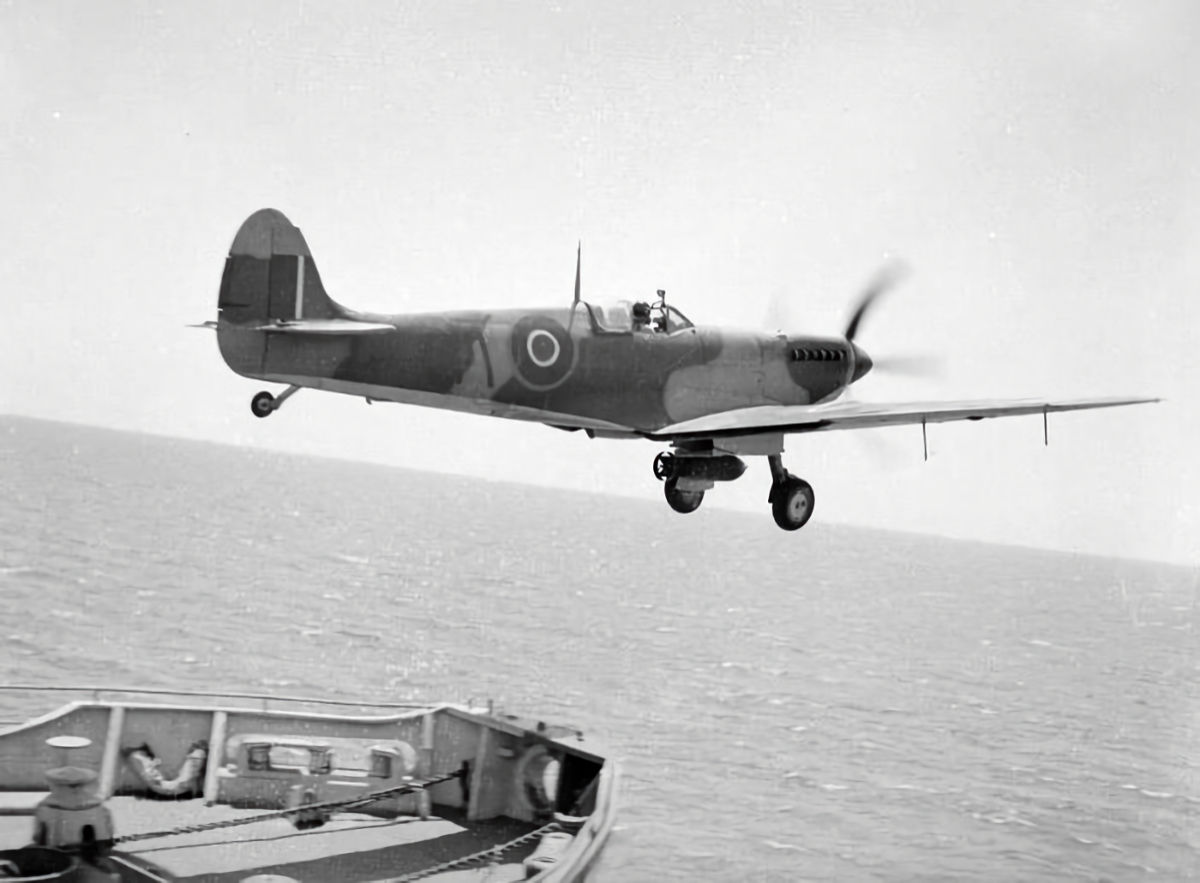 808 Squadron Seafire III with a centreline 500-pound bomb flies off HMS Khedive in August 1944a