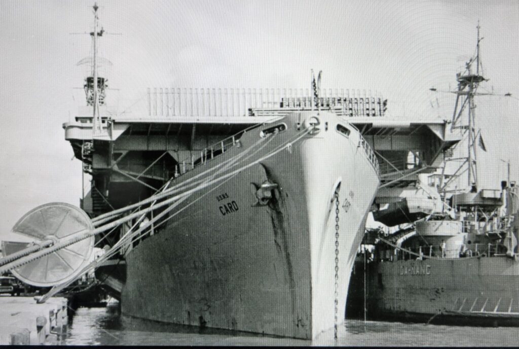 USNS Card T-AKV 40 in a Vietnamese port, in the 1960s