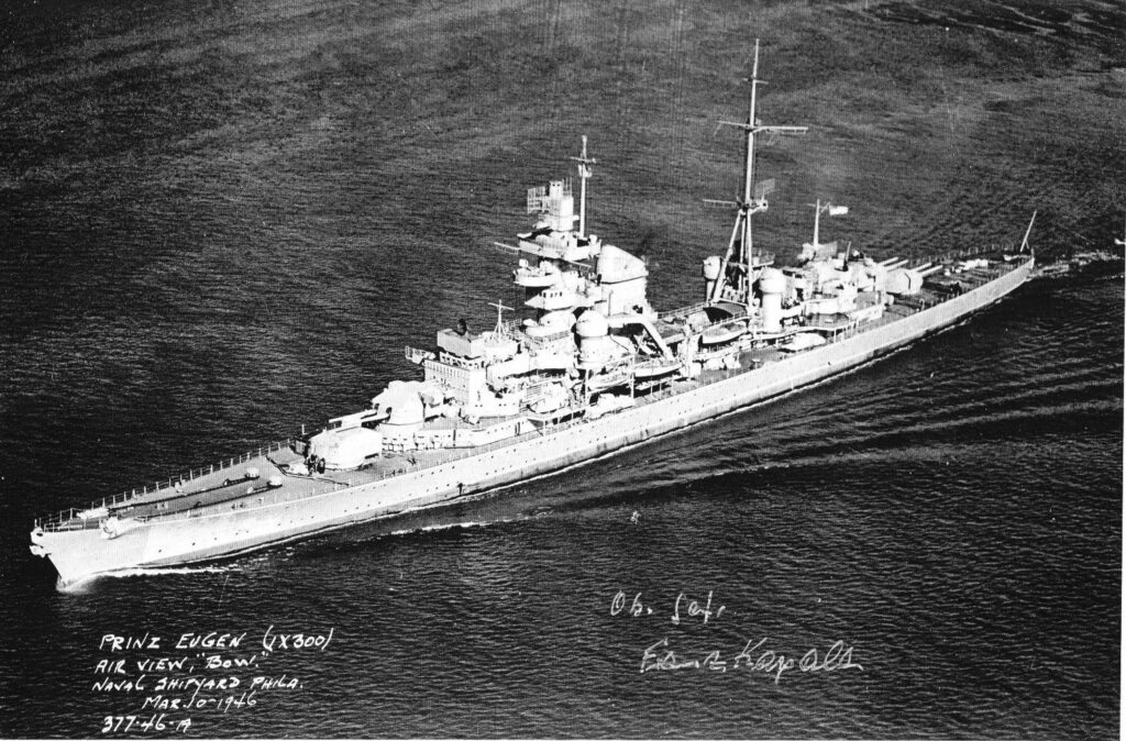 Aerial port bow view of Prinz Eugen (IX-300) sailing from Philadelphia Naval Shipyard, 10 March 1946