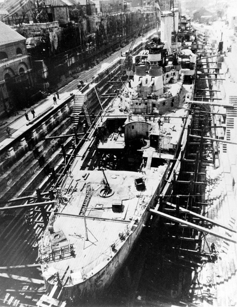 HMAS Hobart under repair at Sutherland Dock on Cockatoo Island, summer 1943